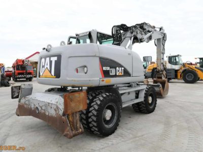 Excavator pe pneuri Caterpillar M313D - 2009