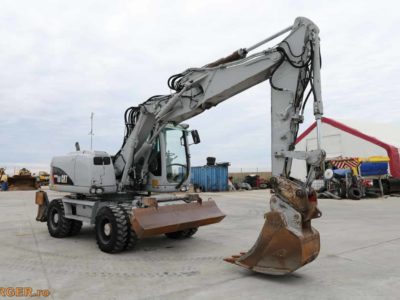 Excavator pe pneuri Caterpillar M313D - 2009