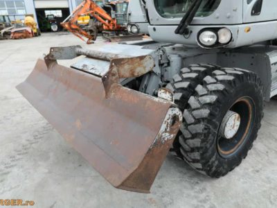 Excavator pe pneuri Caterpillar M313D - 2009